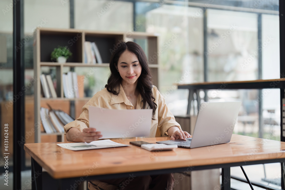 Accountant woman working on laptop and do document, tax, exchange, research, accounting and Financial advisor concept Accountant woman working on laptop and do document, tax, exchange, research, accounting and Financial advisor concept