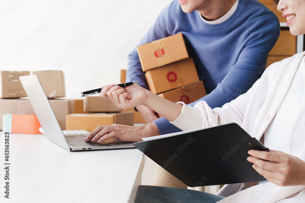 Small business owners couple entrepreneurs working with parcel, e-business, marketing, online shop, sme, entrepreneurs Small business owners couple entrepreneurs working with parcel, e-business, marketing, online shop, sme, entrepreneurs