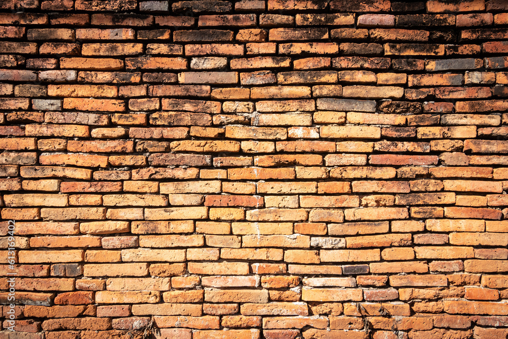 Fototapeta premium Old brick wall with stains. Dirty brick walls that are not plastered background and texture. Background of old vintage brick walls.