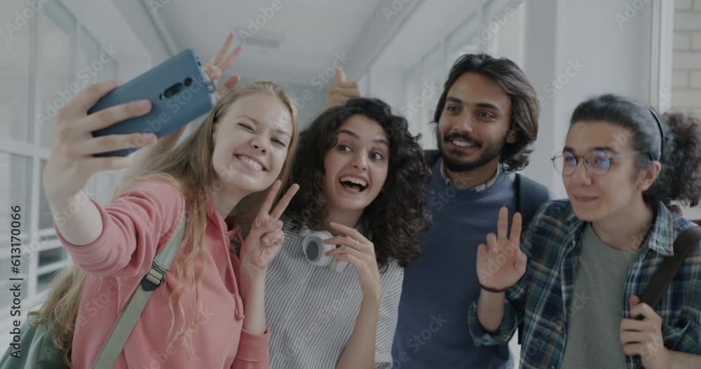 Slow motion of happy girls and guys high school students taking selfie ...