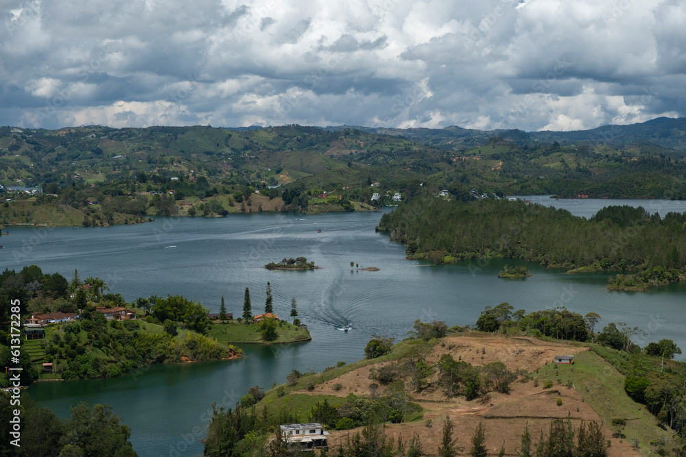 Aerial panoramic view of the hydroelectric reservoir, lakes, mountains and many small islands of Guatape, near Medellin, Colombia. Sunny day, blue sky.