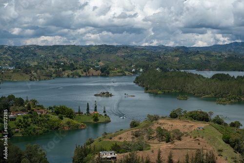 Aerial panoramic view of the hydroelectric reservoir, lakes, mountains and many small islands of Guatape, near Medellin, Colombia. Sunny day, blue sky.