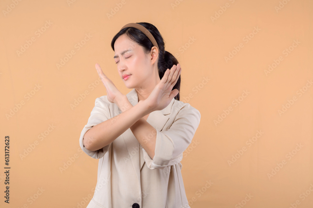 Studio portrait of happy successful confident young asian business woman. Beautiful young lady in white jacket smiling at camera standing isolated on solid beige colour copyspace background Studio portrait of happy successful confident young asian business woman. Beautiful young lady in white jacket smiling at camera standing isolated on solid beige colour copyspace background