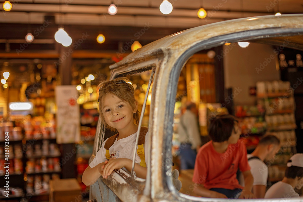 Obraz premium Family with kids, enjoying the Sarona Market in Tel Aviv, Israel