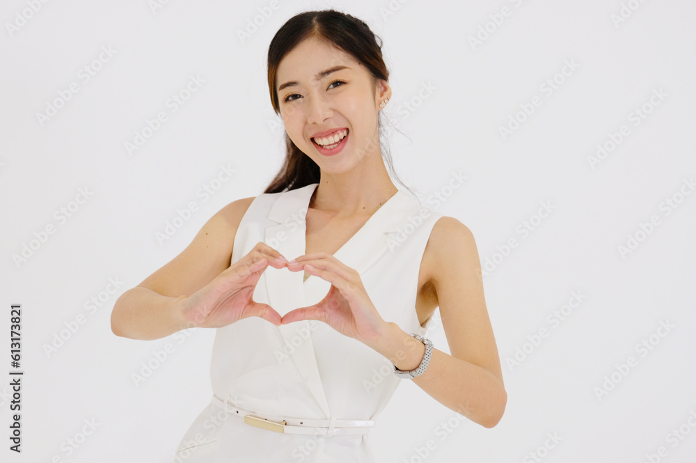 Beautiful business woman smiling heart shaped hands. Beautiful business woman smiling heart shaped hands.