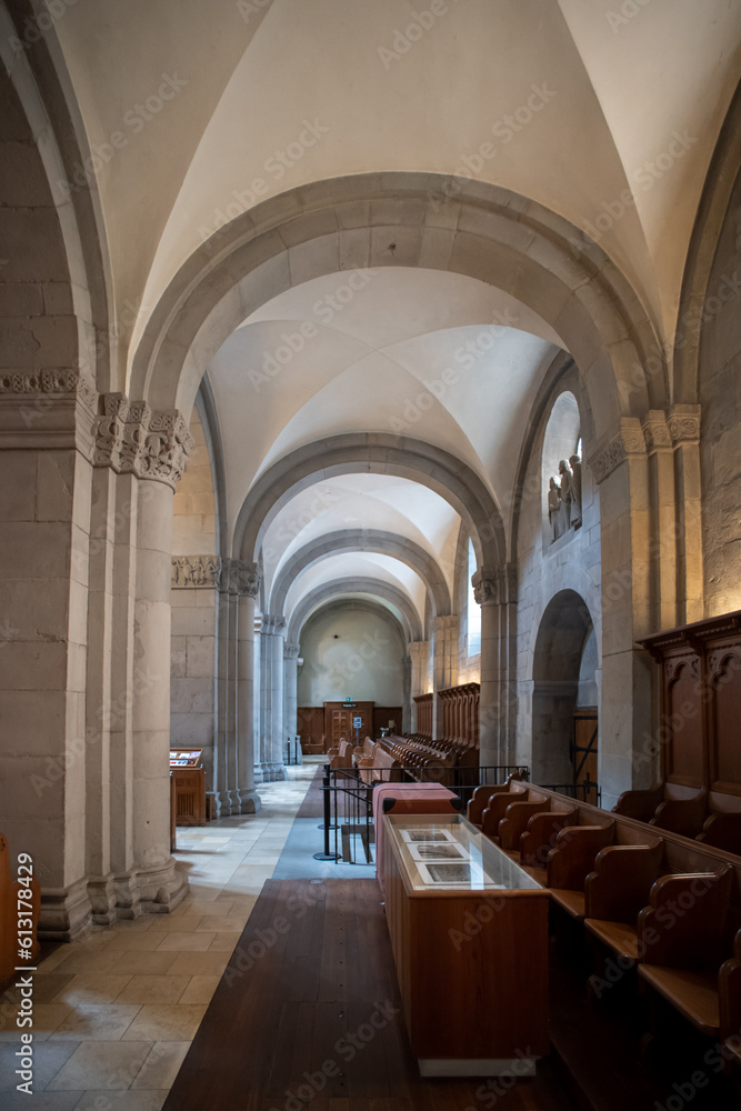 Reformed European church interior with empty wooden pews. Ultra wide angle view, no people