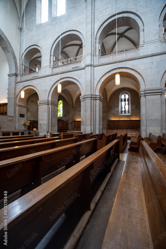 Reformed European church interior with empty wooden pews. Ultra wide angle view, no people