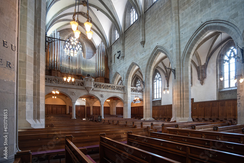 Reformed European church interior with empty wooden pews. Ultra wide angle view  no people