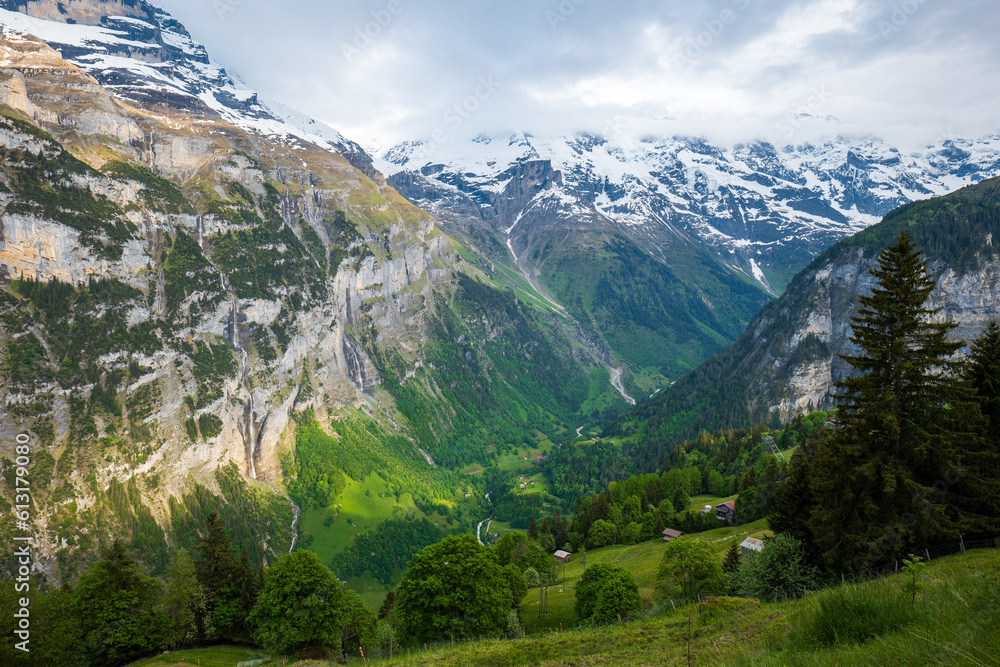 Naklejka premium Beautiful view of Schwarzmonch mountain peak and green valley in the Swiss Alps. Sunny summer day, no people