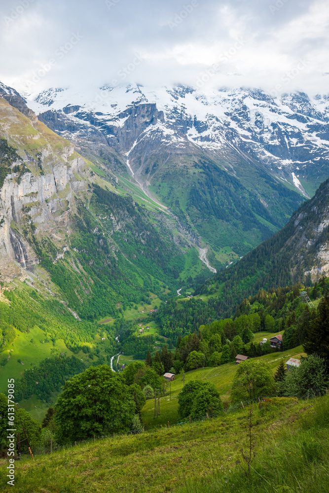 Beautiful view of Schwarzmonch mountain peak and green valley in the Swiss Alps. Sunny summer day, no people