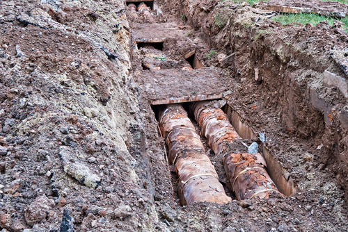 Old water pipes in the ground. Start of dismantling.