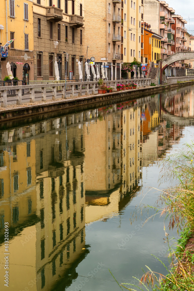 Reflection on the Naviglio Pavese, Milan, Italy