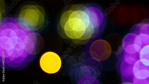 background blurred abstraction of colored lanterns and decorations. bokeh texture of street colored lights