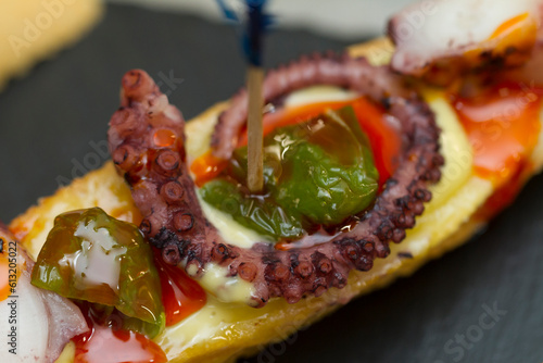 Close up on spanish tapas starters served on a table top. No people are visible