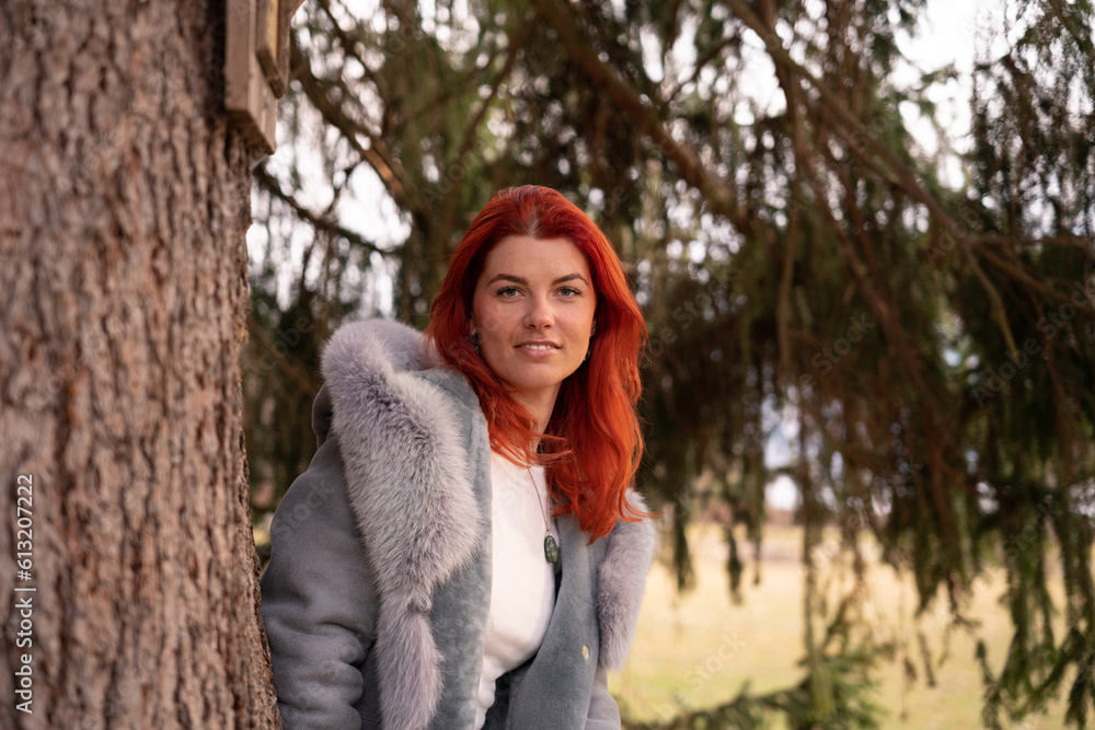 young woman on a gray jacket in a forest young woman on a gray jacket in a forest