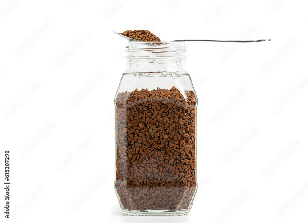 Transparent glass jar with instant granulated coffee on a white background. Transparent glass jar with instant granulated coffee on a white background.