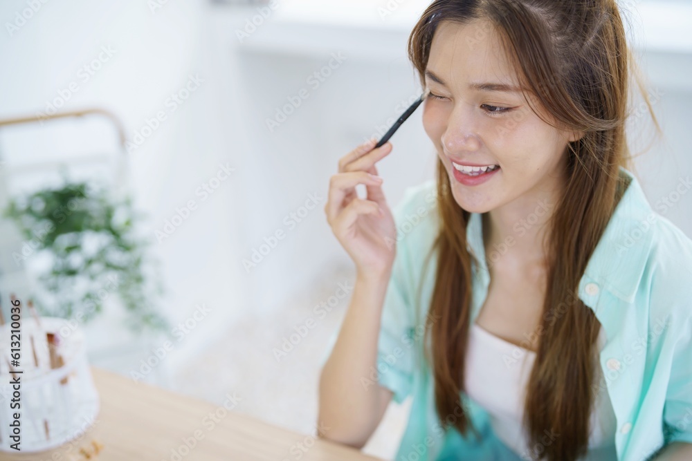 Young Asian girl makeup artist Professional Woman blogger vlogger is showing cosmetics products with recording video Beauty influencer asian girl video online marketing Young Asian girl makeup artist Professional Woman blogger vlogger is showing cosmetics products with recording video Beauty influencer asian girl video online marketing