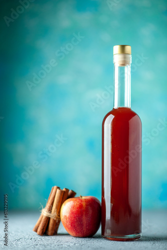 Fototapeta Naklejka Na Ścianę i Meble -  front view apple vinegar with apples on blue background juice fresh drink sour food color red fruit