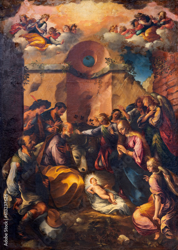 NAPLES, ITALY - APRIL 19, 2023: The painting of Nativity (Adoration of Shepherds) in the church Chiesa del Gesu Nuovo by Girolamo Imparato (1602).