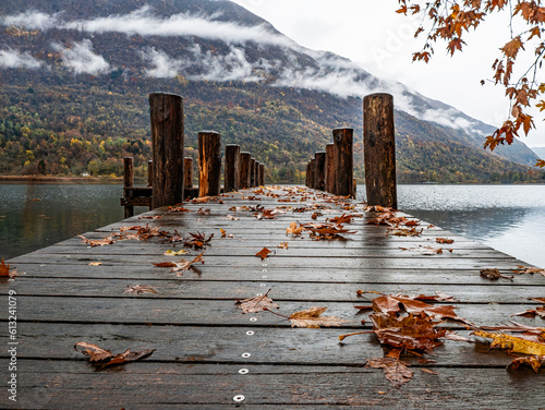 Wood pier on Lake Piano in autumn photo