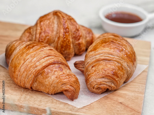 Croissant on chopping board Is a staple food in various pastry shops in France, eaten for breakfast, snacks, eaten with tea