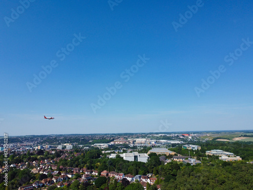 An Airplane is Approaching London Luton Airport to Land. The Footage Was Captured on June 13th, 2023 with Drone's Zoomed in Camera from Low Altitude.