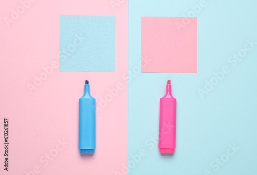 Memo note papers with markers on a blue-pink pastel background
