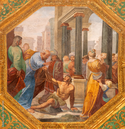 GENOVA, ITALY - MARCH 6, 2023: The fresco Saints Peter and John Healing the Lame Man in the church Basilica della Santissima Annunziata del Vastato by Gioacchino Assereto (1600 – 1649).