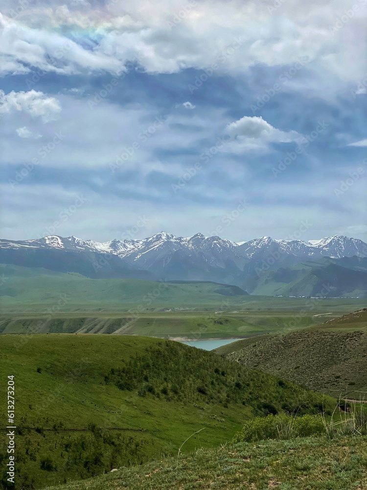 Nature of Kazakhstan, mountains, lake and sky. Tourism, unexplored places, paradise