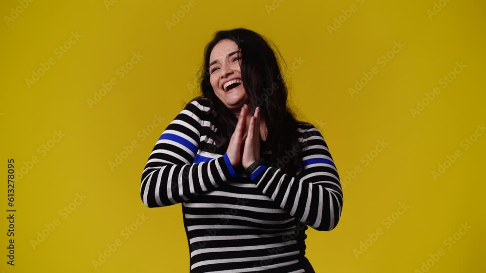 4k video of one woman posing for a video on yellow background. 4k video of one woman posing for a video on yellow background.