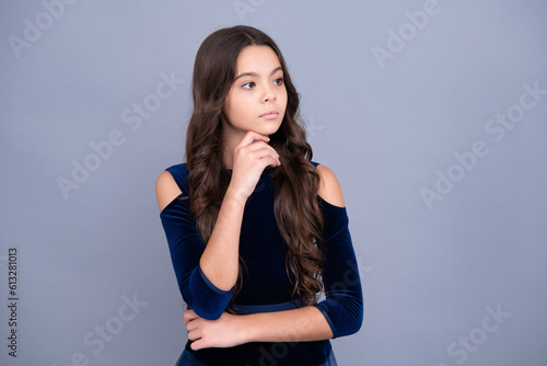 Thinking pensive clever teenager girl. Pretty teenage girl in studio. Child girl portrait.
