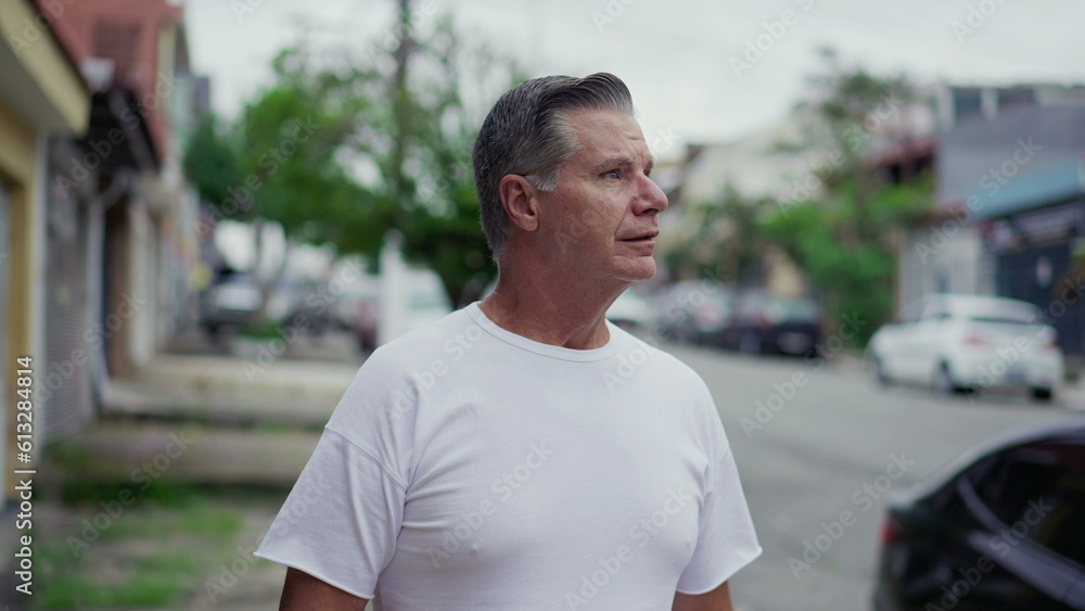 Pensive senior man walk in city sidewalk street. Contemplative thoughtful male caucasian person strolling in urban environment Pensive senior man walk in city sidewalk street. Contemplative thoughtful male caucasian person strolling in urban environment
