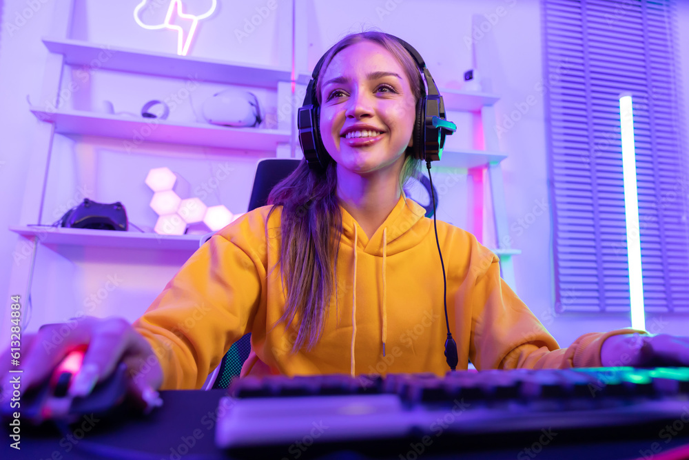 Caucasian Female Gamer Playing PC Game with Mouse and Keyboard in Neon