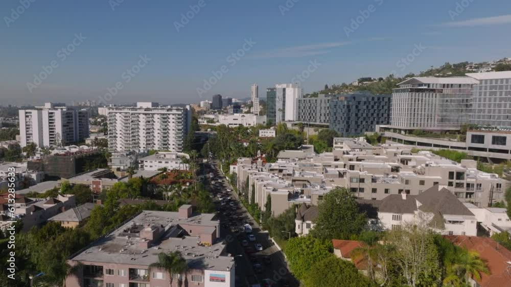 Forwards fly along row of multistorey hotel or apartment buildings in urban district. Los Angeles, California, USA Forwards fly along row of multistorey hotel or apartment buildings in urban district. Los Angeles, California, USA