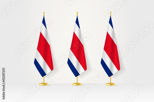Three Costa Rica flags in a row on a golden stand, illustration of press conference and other meetings.