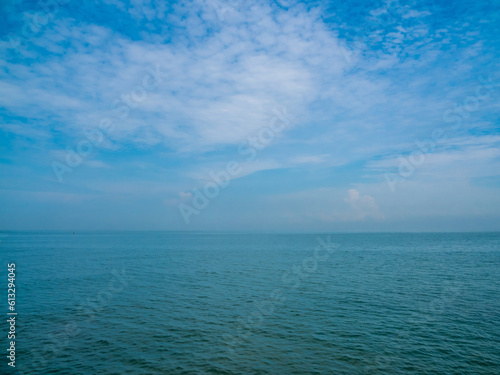 Panorama front view landscape Blue sea rock and sky blue background morning day look calm summer Nature tropical sea Beautiful ocen water travel Bangsaen Beach East thailand Chonburi Exotic horizon.