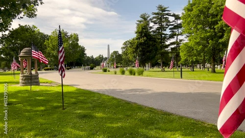 American Flags wave proudly, lining the entrance to Oak Ridge Cemetery, site of the Lincoln Tomb State Historic Site in Springfield, Illinois, USA. photo