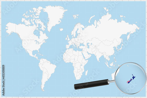 Magnifying glass showing a map of New Zealand on a world map.