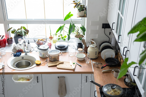 A mess in the kitchen, dirty dishes on the table, scattered things, unsanitary conditions. kitchen is untidy, everyday life