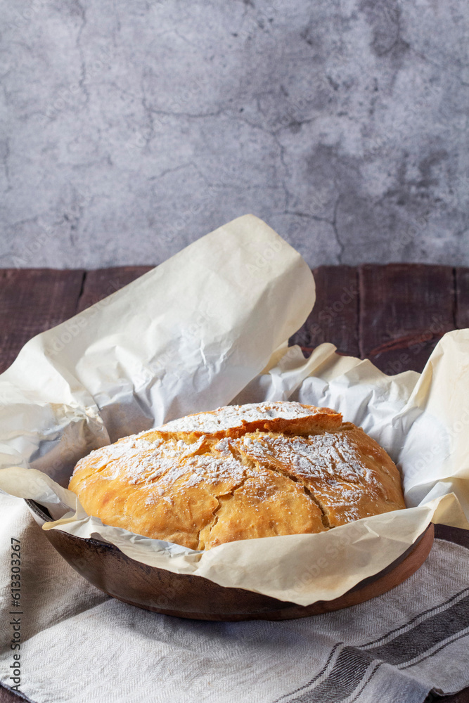 Homemade ciabatta bread with whole grain flour on a wooden background. Rustic style.