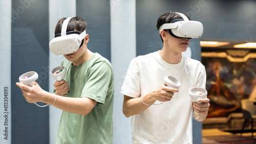 A team of friends playing with VR equipment