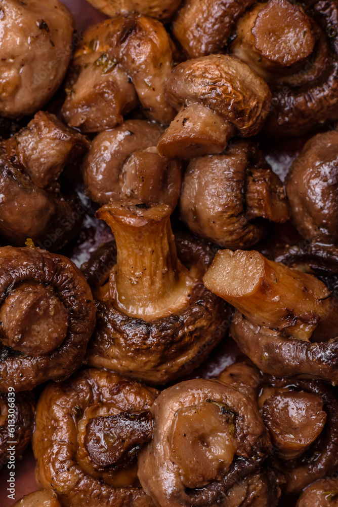 Delicious champignon mushrooms with salt, spices and herbs