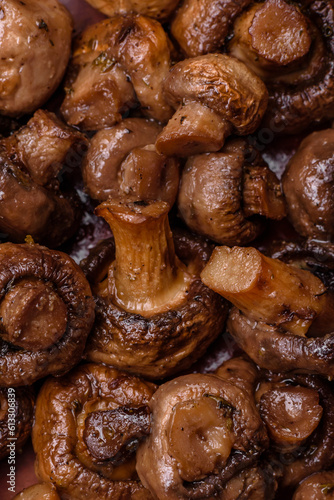 Delicious champignon mushrooms with salt, spices and herbs