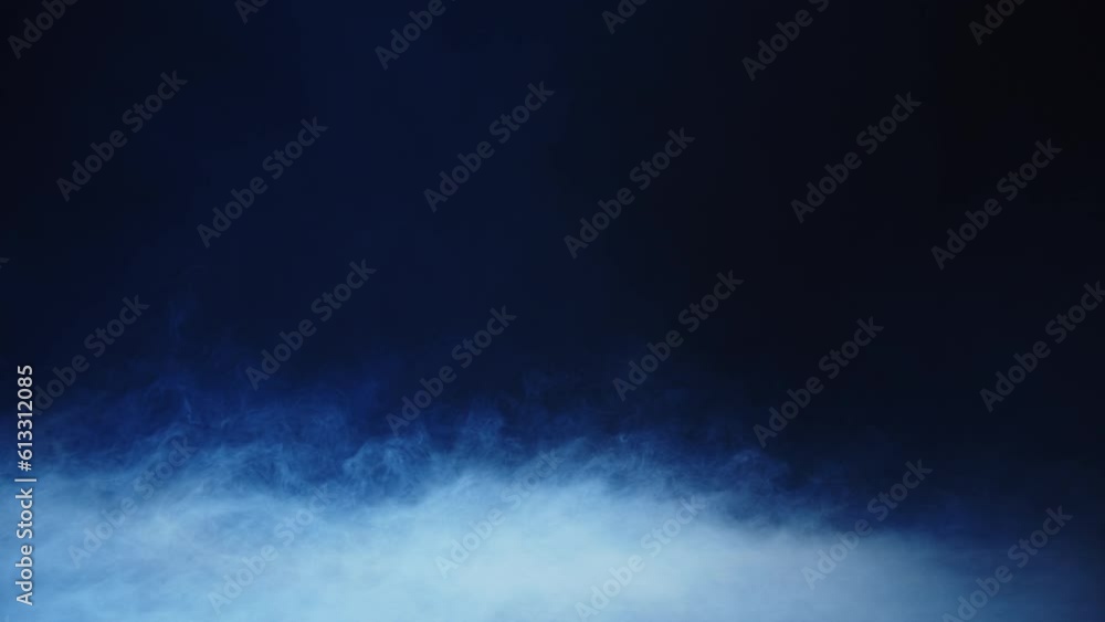 smoke on dark background with blue light smoke on dark background with blue light