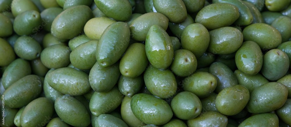 Green olives close-up on the market. Banner Green olives close-up on the market. Banner