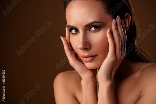 Closeup photo stunning woman with wet hair touch cheeks face tease eyes look studio portrait isolated brown background