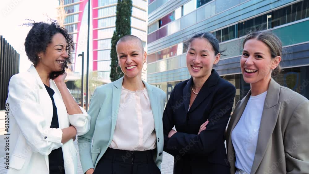 Group of good looking business women standing at workplace and posing for the portrait with successful expression. Empowered and proud female executive colleagues looking at camera with formal suit Group of good looking business women standing at workplace and posing for the portrait with successful expression. Empowered and proud female executive colleagues looking at camera with formal suit