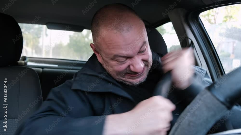 Hated seat belt in the car. The man frantically yanks on the jammed seat belt. Driver safety while driving. Hated seat belt in the car. The man frantically yanks on the jammed seat belt. Driver safety while driving.