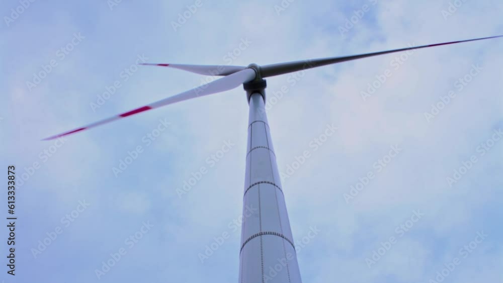 Wind turbines on green field in countryside, aerial view Wind turbines on green field in countryside, aerial view