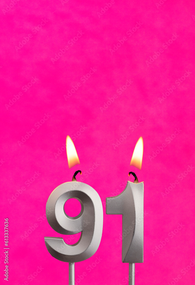 Candle 91 with flame - Birthday card in fuchsia background Candle 91 with flame - Birthday card in fuchsia background